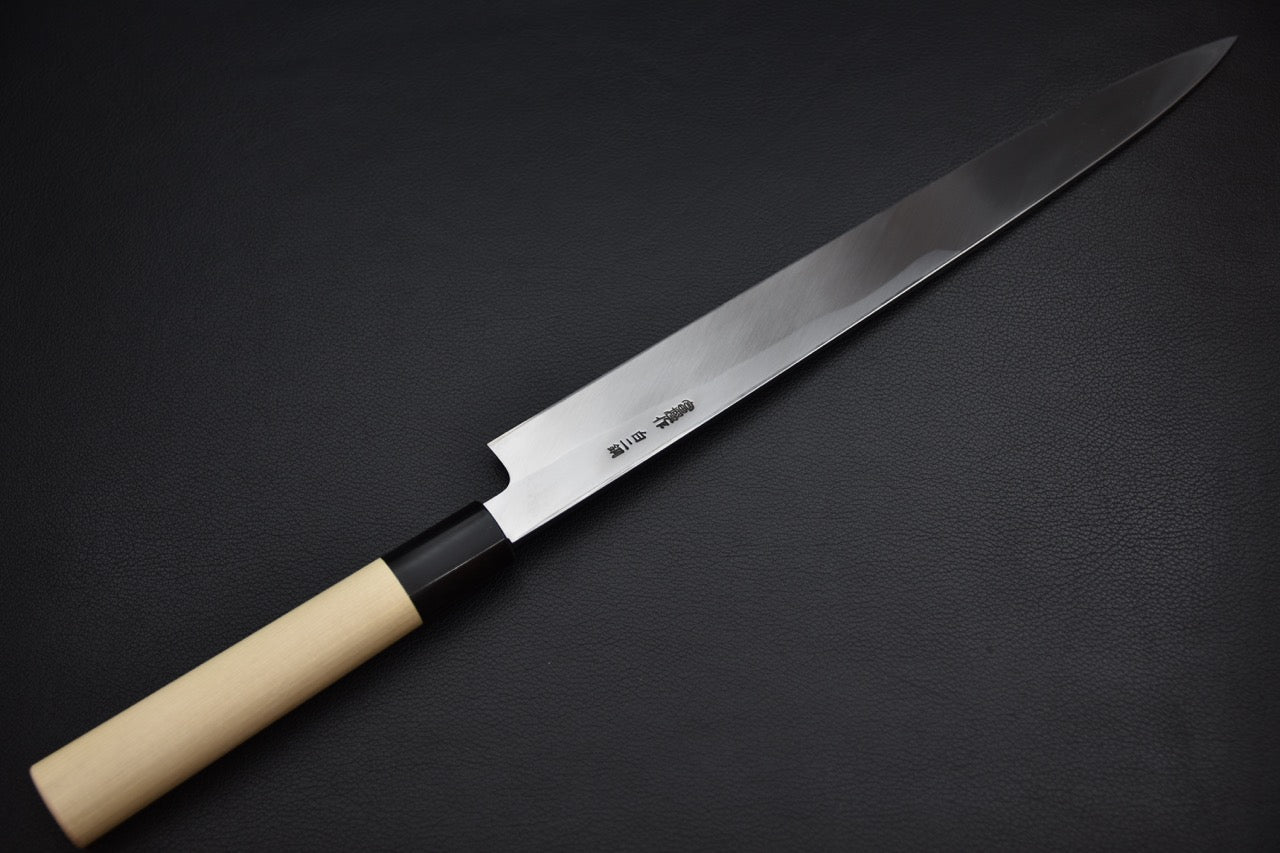 Hitohira yanagiba — détail du manche wa en magnolia et virole sombre, couteau japonais