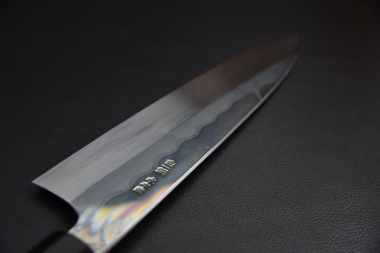 Hitohira Togashi gyuto 240 mm couteau japonais — manche kurokaki vue latérale