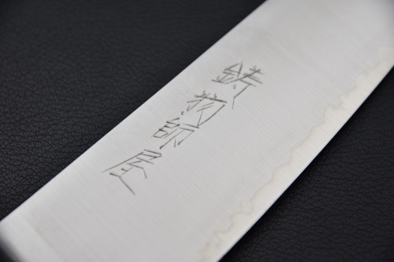 Couteau japonais gyuto profil fluide avec lame affûtée et biseau régulier