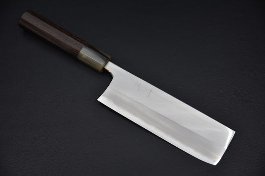 Japanese nakiri knife with a polished rectangular blade and dark wooden handle, displayed on a black background.