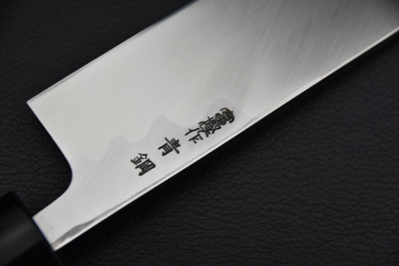 Couteau japonais Hitohira Togashi Edo Saki 180 mm, gros plan sur le manche en bois de ho et la virole noire.
