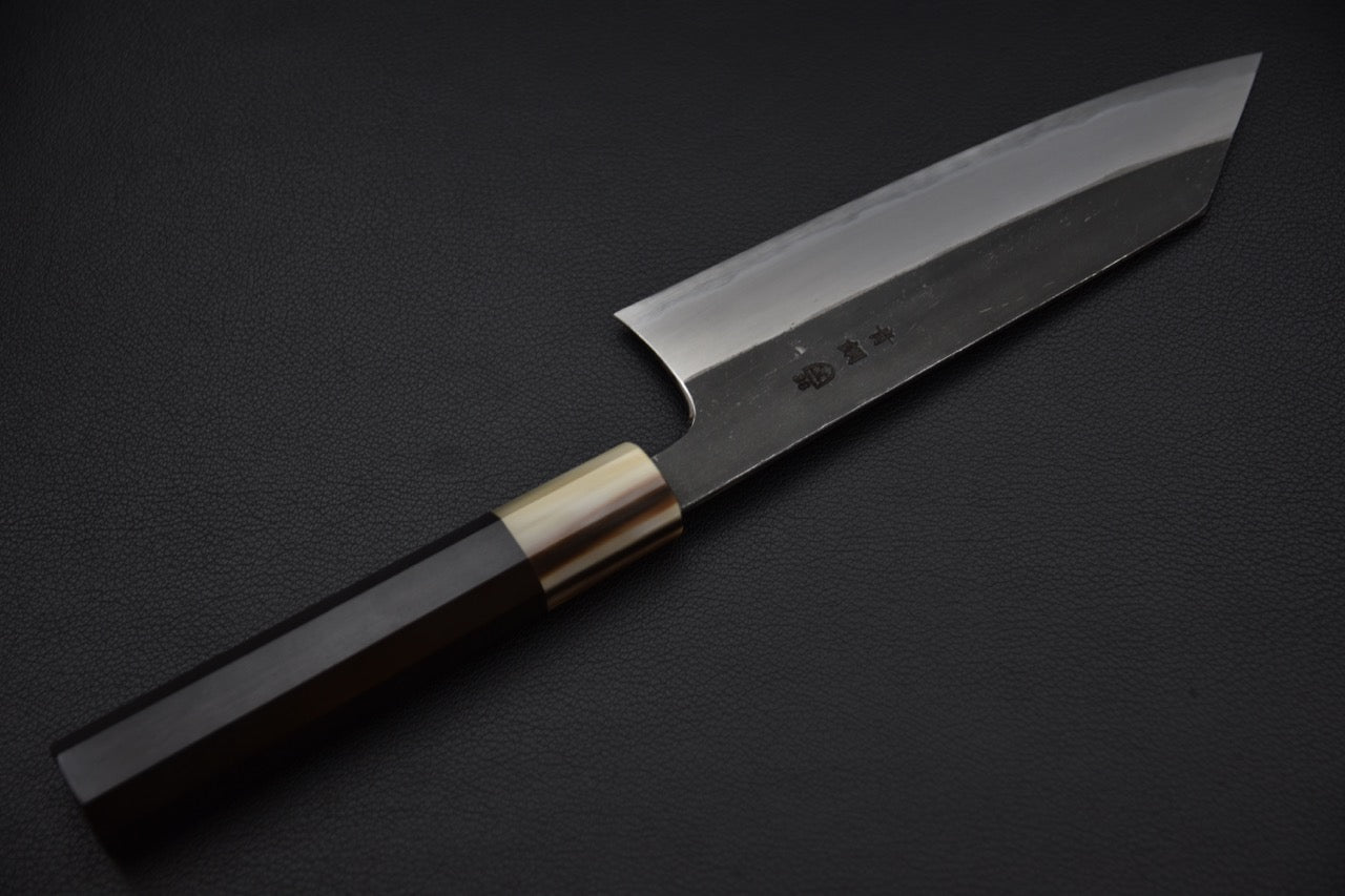 Face opposée du couteau avec estampilles visibles du forgeron.