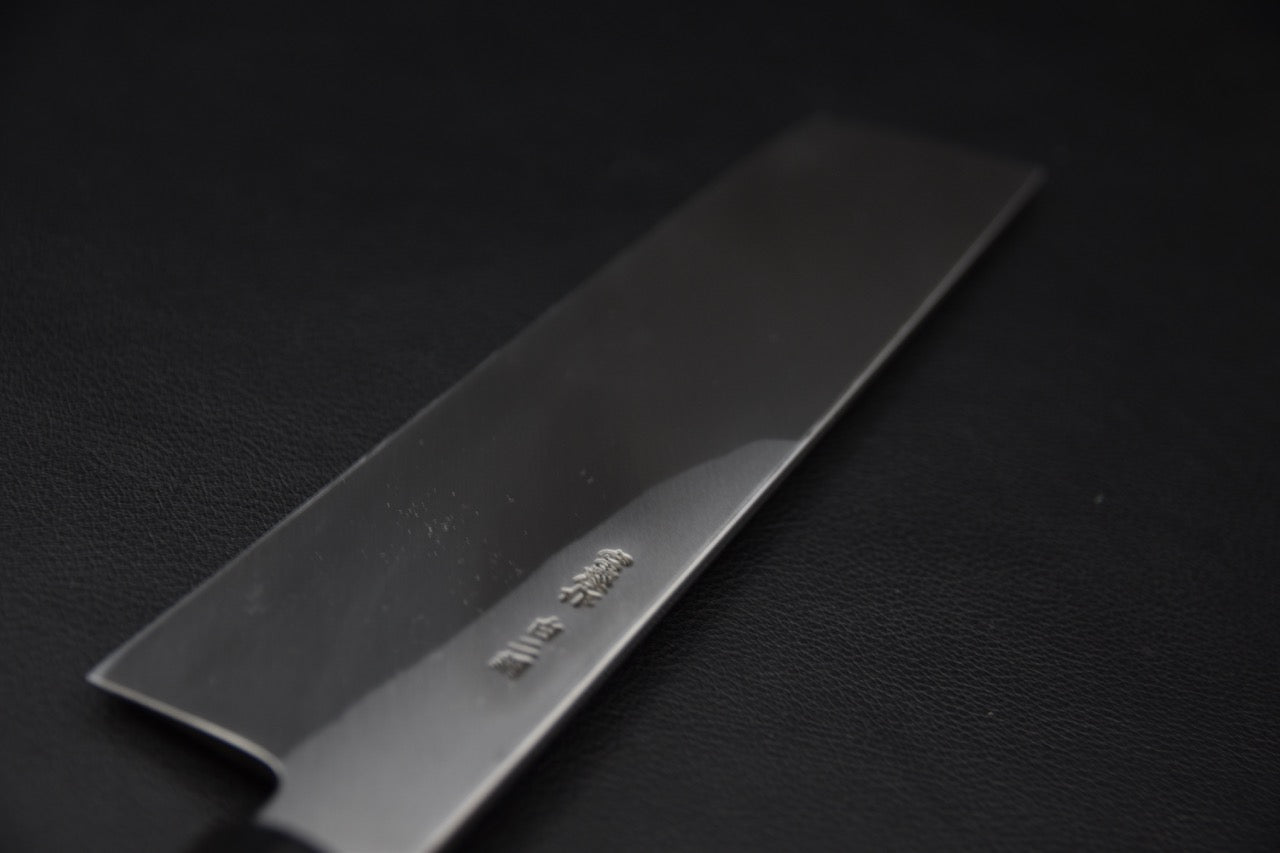 Vue du manche japonais octogonal en bois de ho avec virole noire