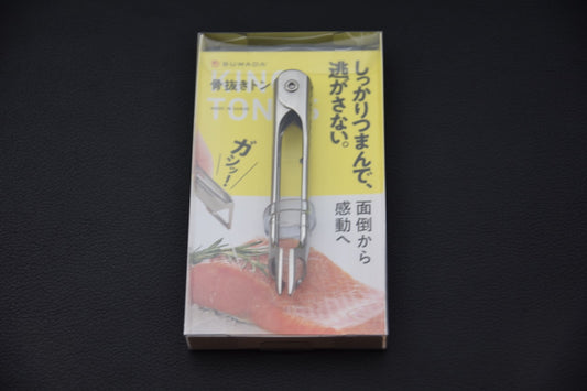 pince à arêtes Suwada en acier inoxydable vue de face dans son emballage.