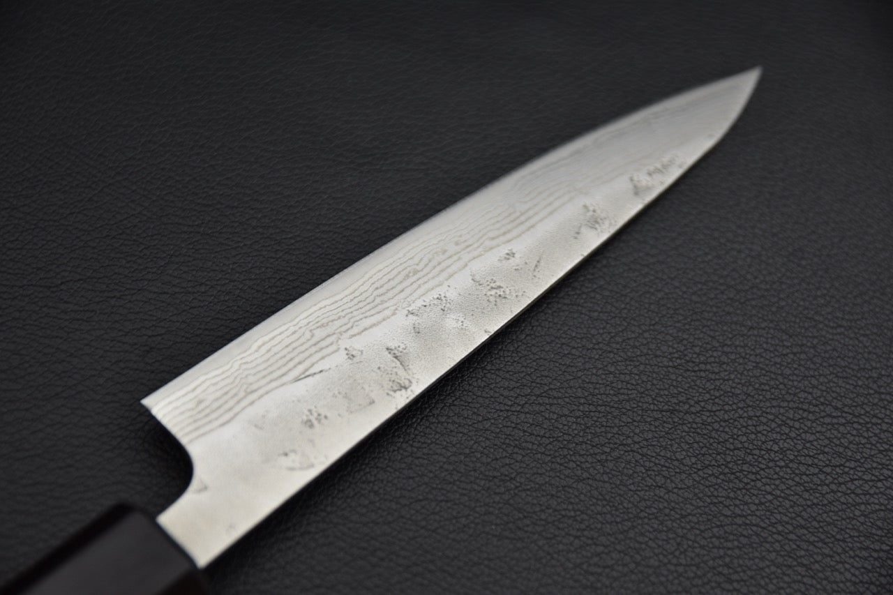 Hitohira petty 135 mm couteau japonais — vue de la lame côté pointe, finition et tranchant