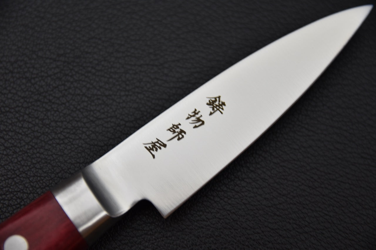 Couteau japonais 80 mm — détail du tranchant et de la pointe