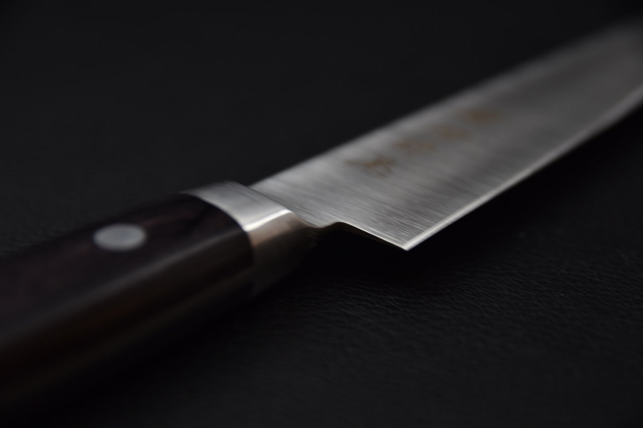 Couteau japonais avec manche en bois sombre