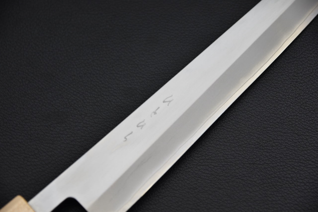 Couteau japonais sujihiki — détail de la gravure kanji sur la lame SKD