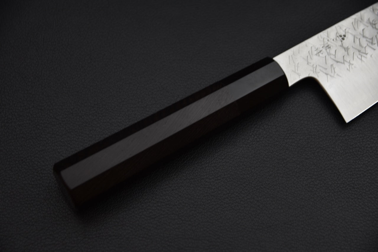 Nigara Hamono gyuto 210 mm — détail du manche en ébène octogonal et jonction avec la lame