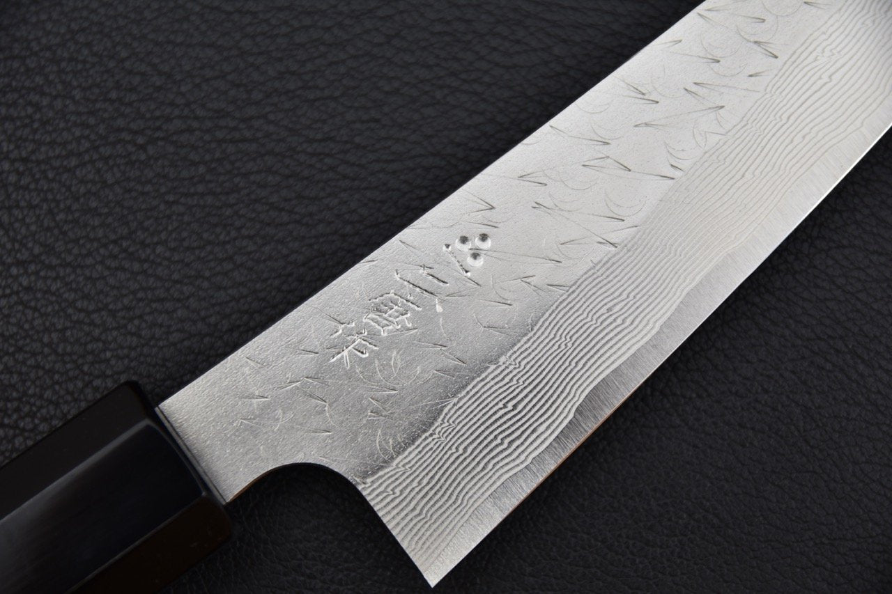 Couteau japonais avec motifs damas et manche noir