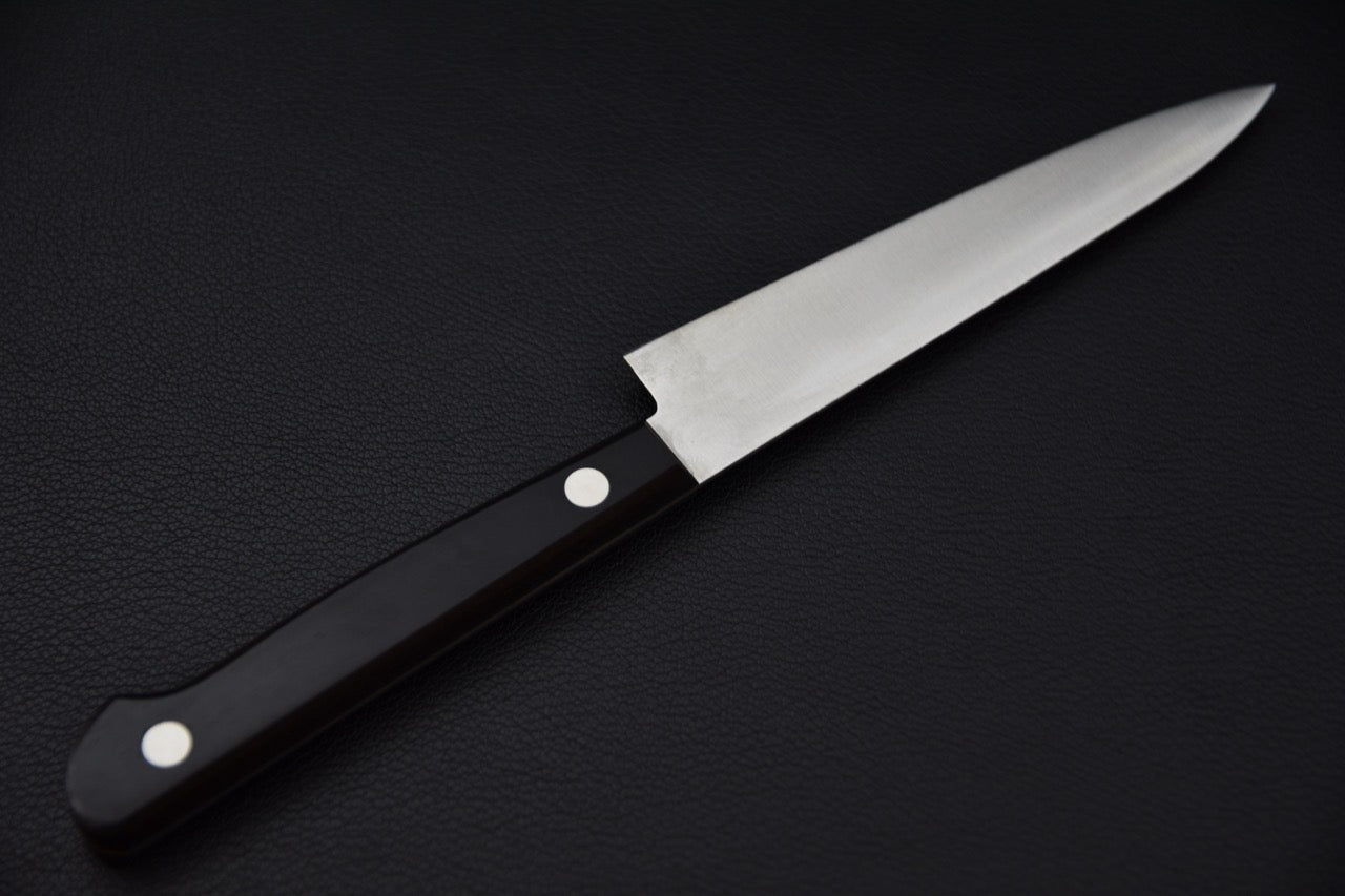 Couteau japonais petty — détail du tranchant et du talon de lame