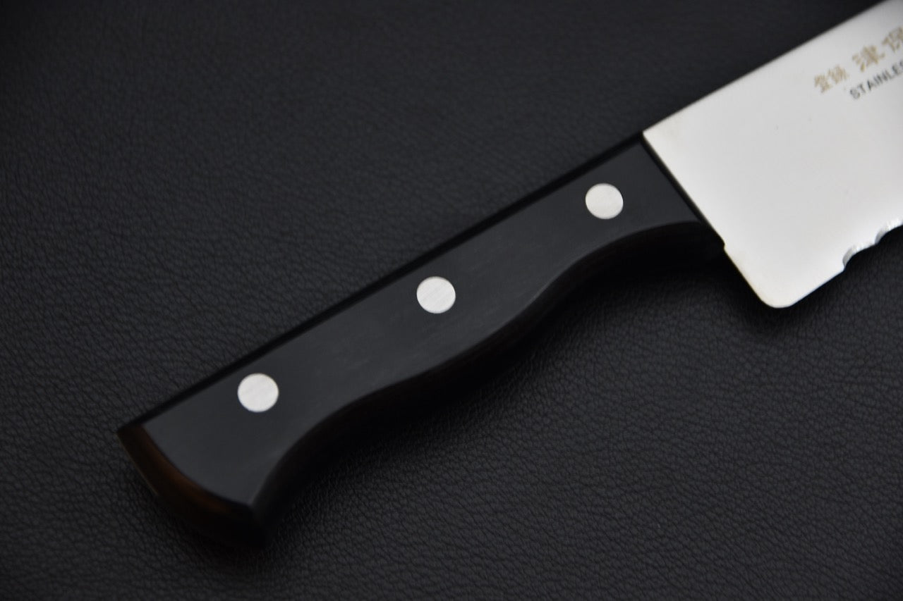 Couteau à pain — détail du manche pakka noir avec trois rivets en acier inoxydable